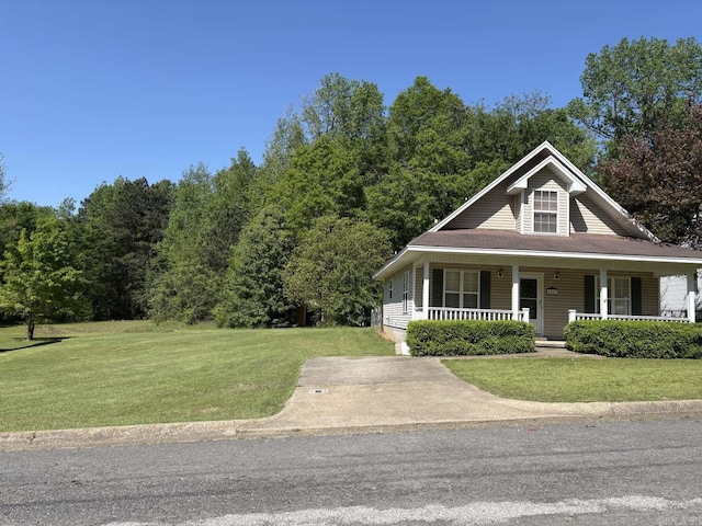 farmhouse with a front lawn and a porch