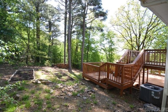 12904 Southridge Dr, Little Rock, AR 72212 - view of yard featuring a deck, cooling unit, and stairs