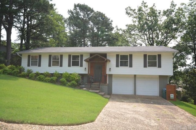 12904 Southridge Dr, Little Rock, AR 72212 - bi-level home with a garage, concrete driveway, and a front lawn