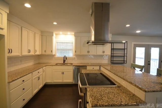 12904 Southridge Dr, Little Rock, AR 72212 - kitchen featuring a sink, island exhaust hood, stainless steel dishwasher, tasteful backsplash, and french doors
