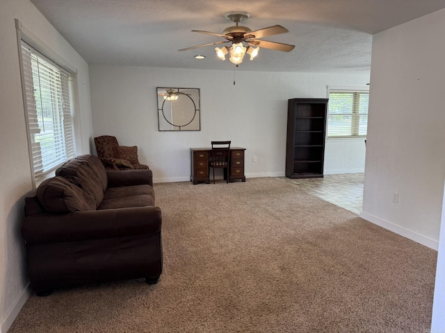 62 Ruby Ln, Melbourne, AR 72556 - living room featuring baseboards, a ceiling fan, and carpet floors