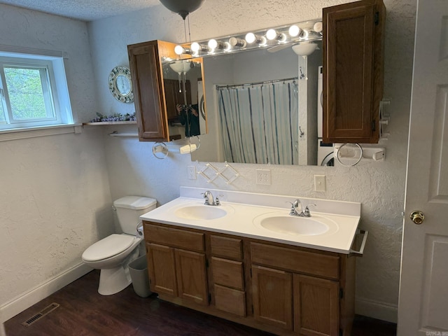 62 Ruby Ln, Melbourne, AR 72556 - bathroom with toilet, wood finished floors, a sink, and visible vents