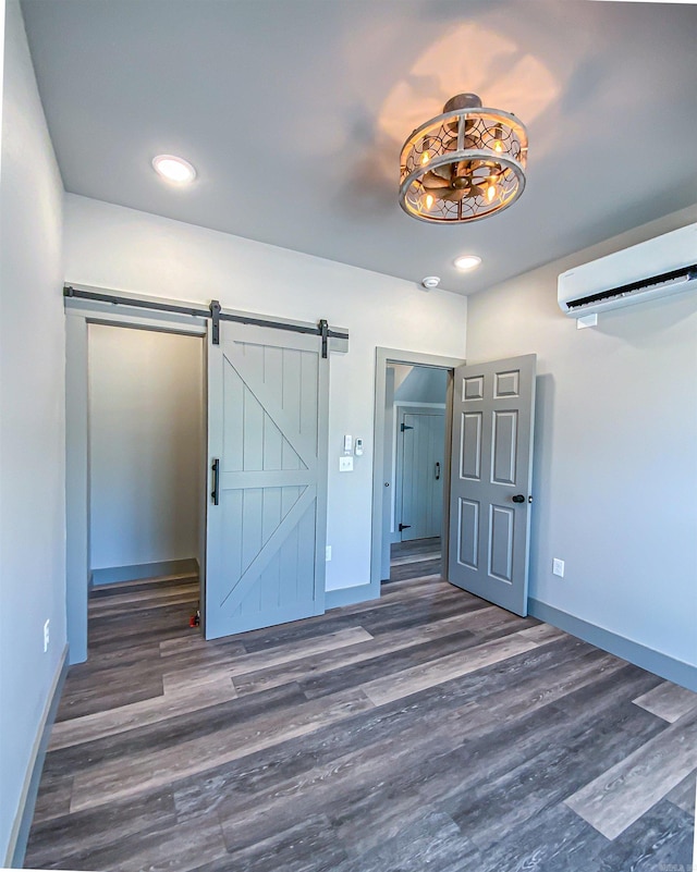 unfurnished bedroom featuring baseboards and dark wood-type flooring