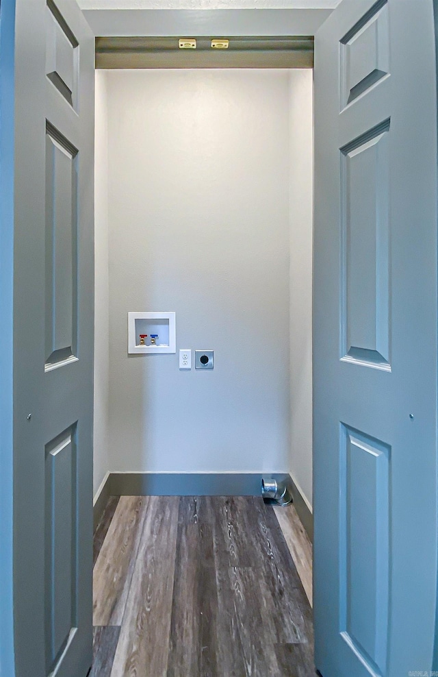 laundry area featuring hookup for a washing machine, electric dryer hookup, wood finished floors, and laundry area