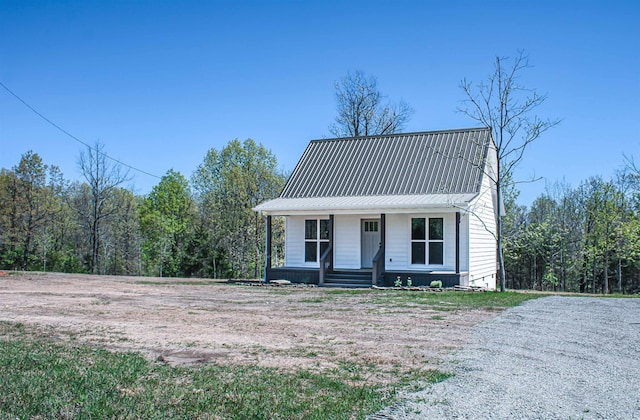 view of front of home featuring a porch and metal roof