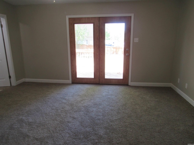 spare room with carpet flooring and baseboards