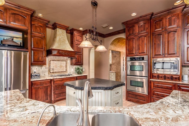 1130 Applewood Dr, Conway, AR 72034 - kitchen with tasteful backsplash, custom range hood, a sink, and stainless steel appliances