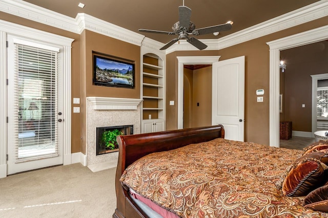 1130 Applewood Dr, Conway, AR 72034 - carpeted bedroom featuring baseboards, a fireplace, crown molding, a ceiling fan, and access to exterior