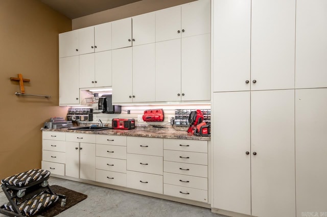 1130 Applewood Dr, Conway, AR 72034 - kitchen featuring a sink, white cabinets, and concrete floors