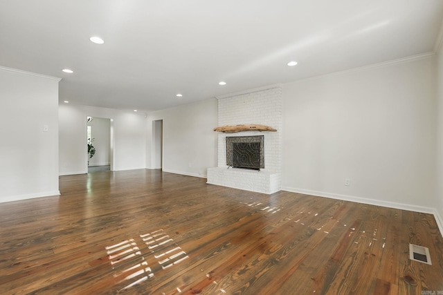 unfurnished living room featuring recessed lighting, visible vents, and ornamental molding