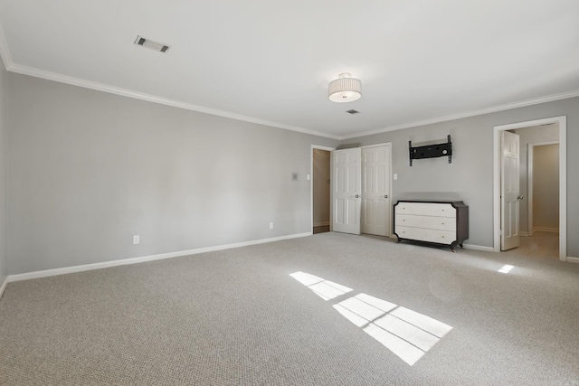 unfurnished bedroom with baseboards, visible vents, light colored carpet, and ornamental molding
