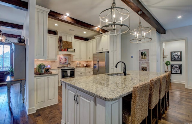 2136 Avondale, Benton, AR 72019 - kitchen with beamed ceiling, a sink, a notable chandelier, and stainless steel appliances