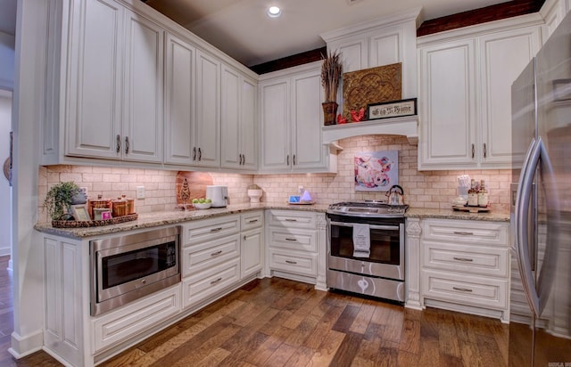 2136 Avondale, Benton, AR 72019 - kitchen featuring white cabinets, appliances with stainless steel finishes, light stone countertops, and dark wood-style floors