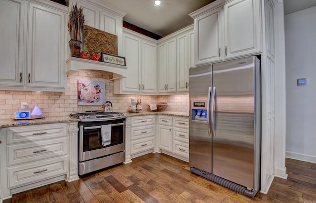 2136 Avondale, Benton, AR 72019 - kitchen featuring dark wood-style floors, white cabinetry, decorative backsplash, and appliances with stainless steel finishes