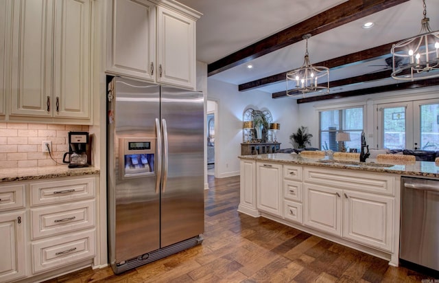 2136 Avondale, Benton, AR 72019 - kitchen featuring an inviting chandelier, a sink, dark wood-style floors, and stainless steel appliances