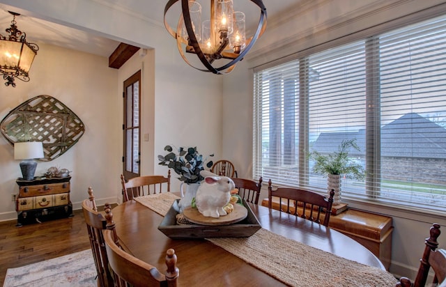 2136 Avondale, Benton, AR 72019 - dining room with a chandelier, crown molding, wood finished floors, and baseboards