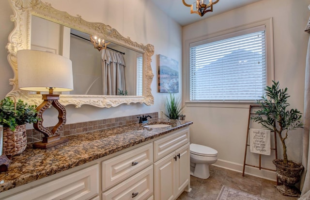 2136 Avondale, Benton, AR 72019 - full bath with vanity, a notable chandelier, baseboards, and toilet