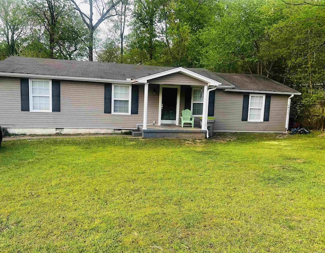 single story home featuring crawl space, covered porch, a front yard, and roof with shingles