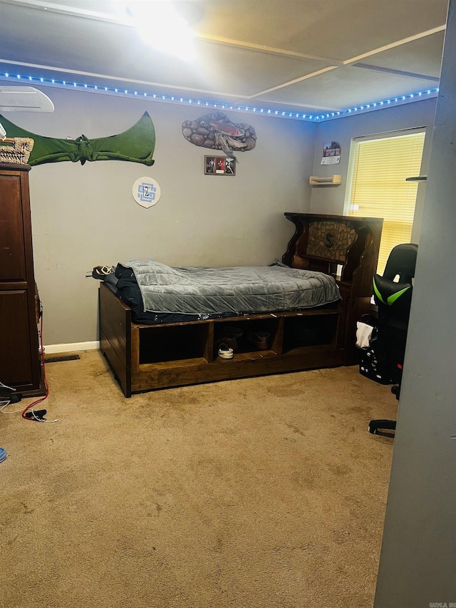 bedroom featuring carpet flooring and visible vents