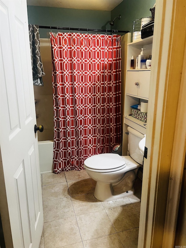 bathroom featuring tile patterned flooring and toilet