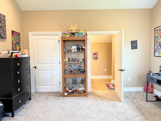 bedroom featuring baseboards and carpet flooring