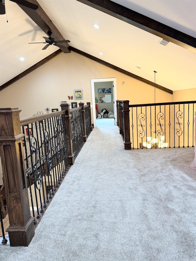 corridor featuring carpet floors, recessed lighting, vaulted ceiling with beams, and visible vents