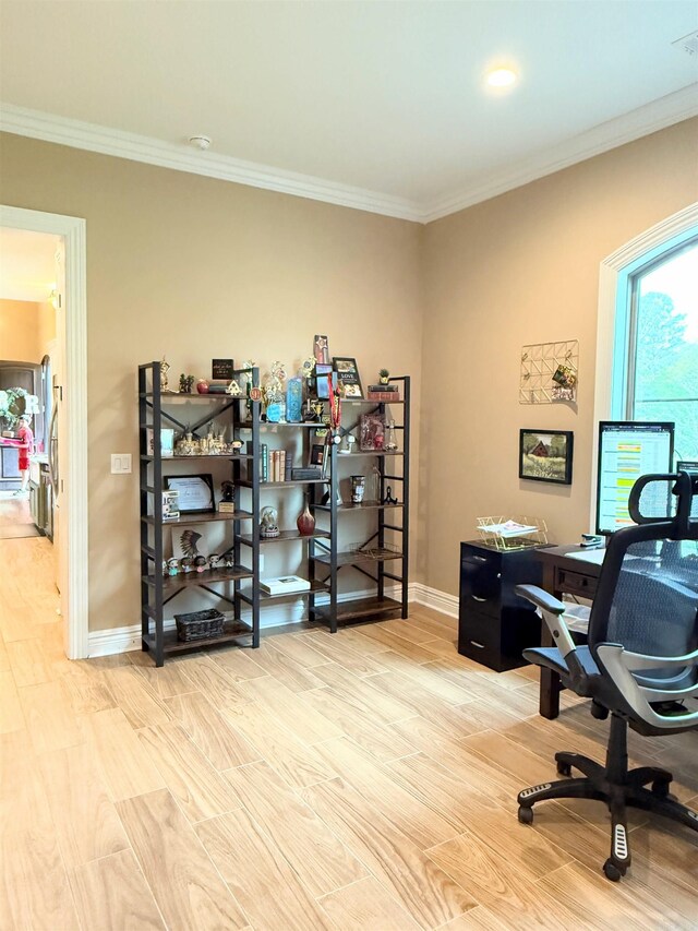 office space featuring wood finished floors, baseboards, and ornamental molding
