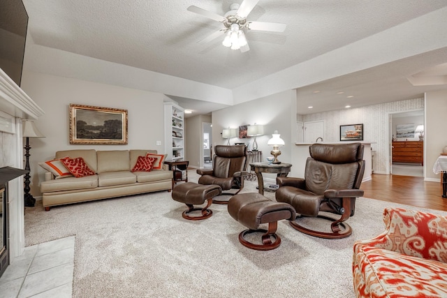 13 Arista Ln, Hot Springs Village, AR 71909 - carpeted living room with baseboards, a textured ceiling, and a ceiling fan