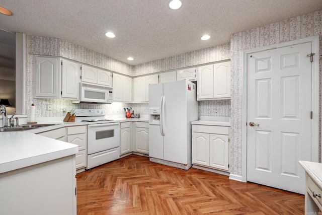 13 Arista Ln, Hot Springs Village, AR 71909 - kitchen with wallpapered walls, recessed lighting, white appliances, a textured ceiling, and a sink