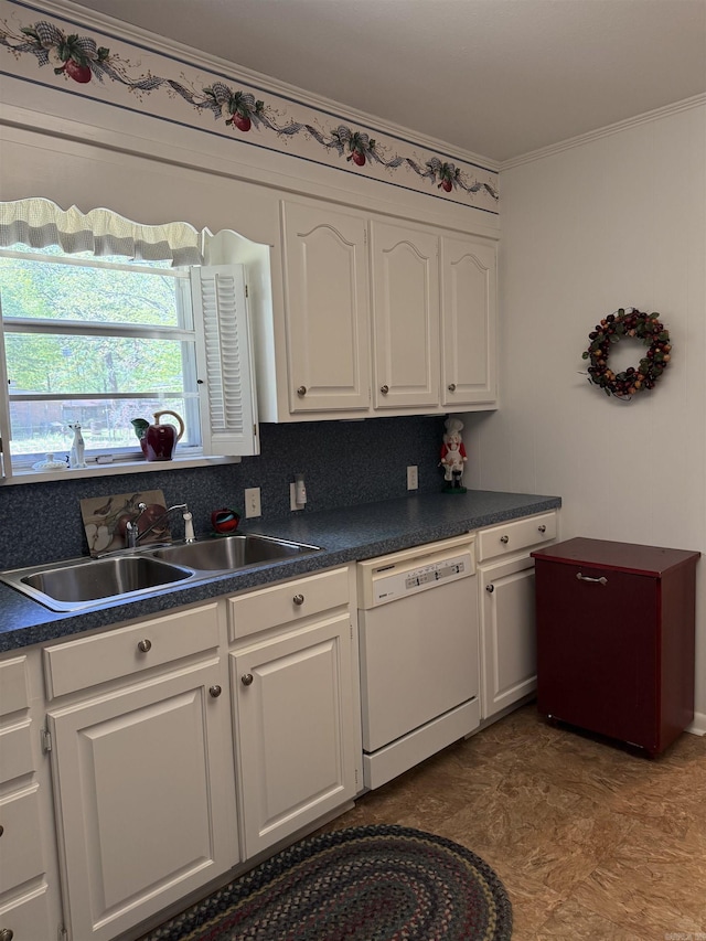 1019 Amanda St, Camden, AR 71701 - kitchen with dishwasher, white cabinets, a sink, dark countertops, and crown molding