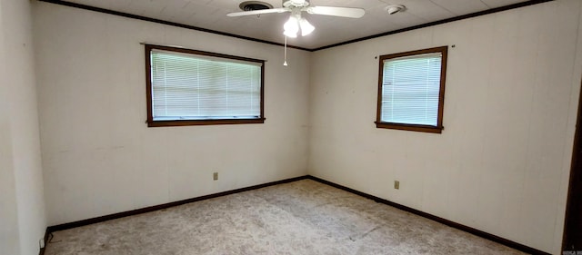 1019 Amanda St, Camden, AR 71701 - spare room with light carpet, a ceiling fan, ornamental molding, and baseboards