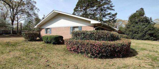1019 Amanda St, Camden, AR 71701 - view of home's exterior featuring a lawn and brick siding