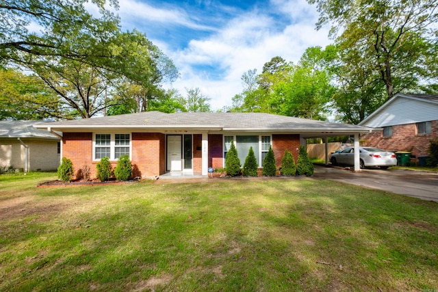 124 Hiawatha Dr, Little Rock, AR 72211 - ranch-style house with brick siding, a front lawn, an attached carport, and driveway