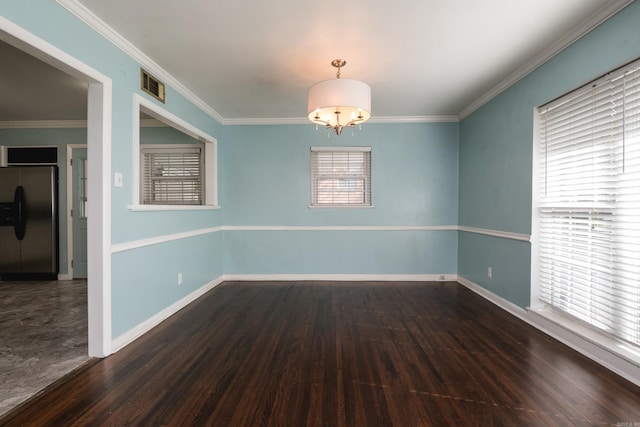 124 Hiawatha Dr, Little Rock, AR 72211 - unfurnished room featuring crown molding, an inviting chandelier, baseboards, and visible vents