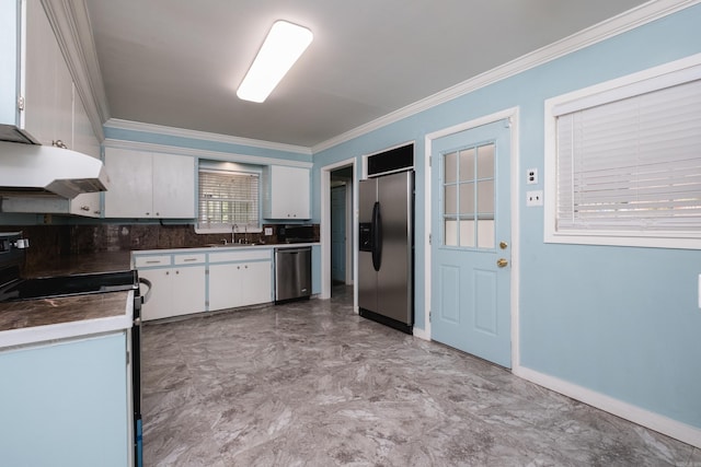 124 Hiawatha Dr, Little Rock, AR 72211 - kitchen with a sink, under cabinet range hood, crown molding, white cabinetry, and stainless steel appliances