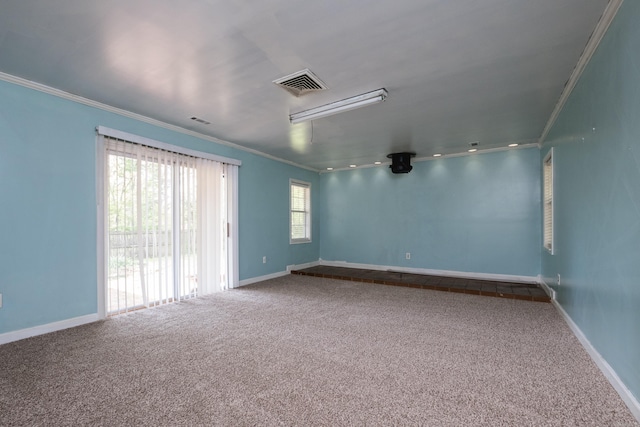124 Hiawatha Dr, Little Rock, AR 72211 - carpeted spare room with visible vents, baseboards, and ornamental molding
