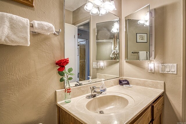 20 Cortez Way, Hot Springs Village, AR 71909 - bathroom with a textured wall and vanity