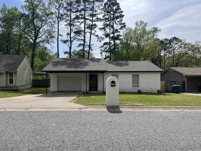 12617 Valleywood Dr, Little Rock, AR 72211 - single story home featuring a front yard, an attached garage, brick siding, and driveway