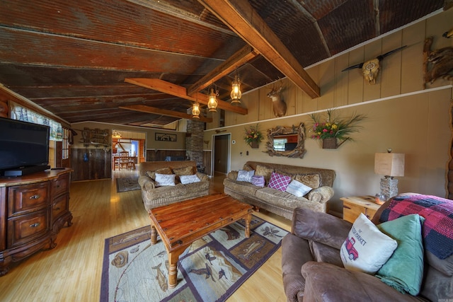 living area featuring wood ceiling, wood finished floors, and lofted ceiling with beams