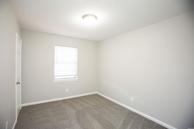 28 Wellford Dr, Little Rock, AR 72209 - empty room featuring a textured ceiling, carpet flooring, and baseboards