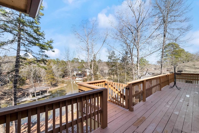 wooden deck featuring a water view
