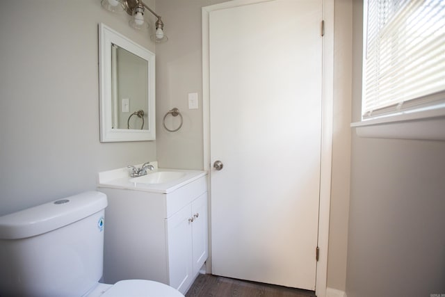7204 W Wakefield Dr, Little Rock, AR 72209 - bathroom with vanity, toilet, and wood finished floors