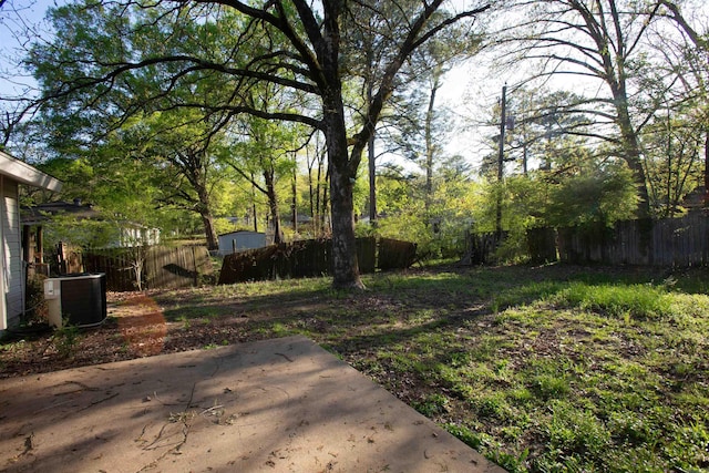 7204 W Wakefield Dr, Little Rock, AR 72209 - view of yard with a patio area, central AC unit, and a fenced backyard