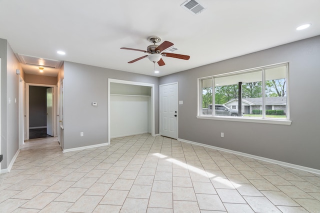 interior space with recessed lighting, visible vents, baseboards, and a ceiling fan