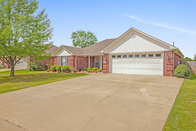 2540 Gladiola, Conway, AR 72034 - single story home featuring brick siding, a front yard, an attached garage, and concrete driveway