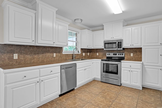 2540 Gladiola, Conway, AR 72034 - kitchen featuring a sink, white cabinetry, and stainless steel appliances