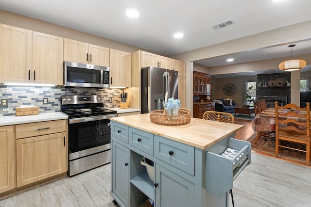 16 Valley Rd, Cabot, AR 72023 - kitchen with stainless steel appliances, visible vents, butcher block counters, and light brown cabinetry