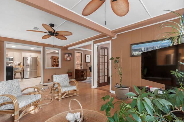 16 Valley Rd, Cabot, AR 72023 - living area with light wood-style flooring, wooden walls, a ceiling fan, and visible vents