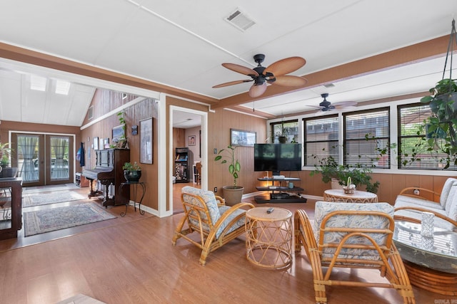 16 Valley Rd, Cabot, AR 72023 - living room with ceiling fan, visible vents, wood finished floors, wood walls, and french doors