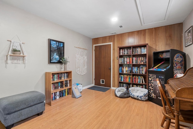 16 Valley Rd, Cabot, AR 72023 - sitting room with visible vents, baseboards, wooden walls, attic access, and wood finished floors